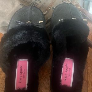 Ladies black slip on slippers by Kate Spade. Never worn. No tags